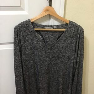 Athleta woman’s black and grey open back workout long sleeve workout shirt med